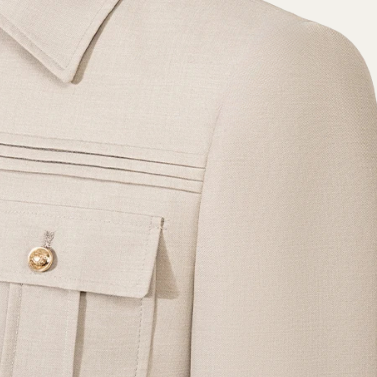 Beige business suit jacket front with flap pockets and gold-tone button closures