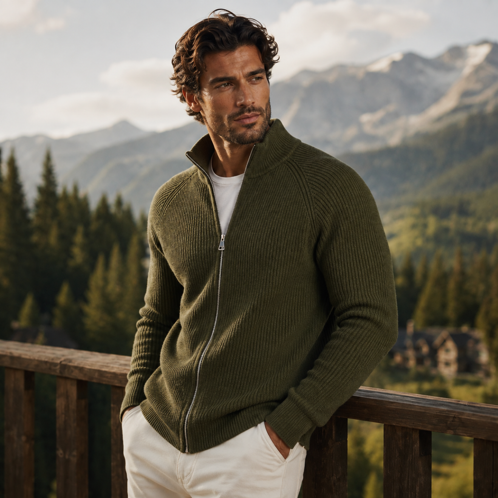 Men's green merino wool zip-up cardigan on model, stand collar and front zipper visible.