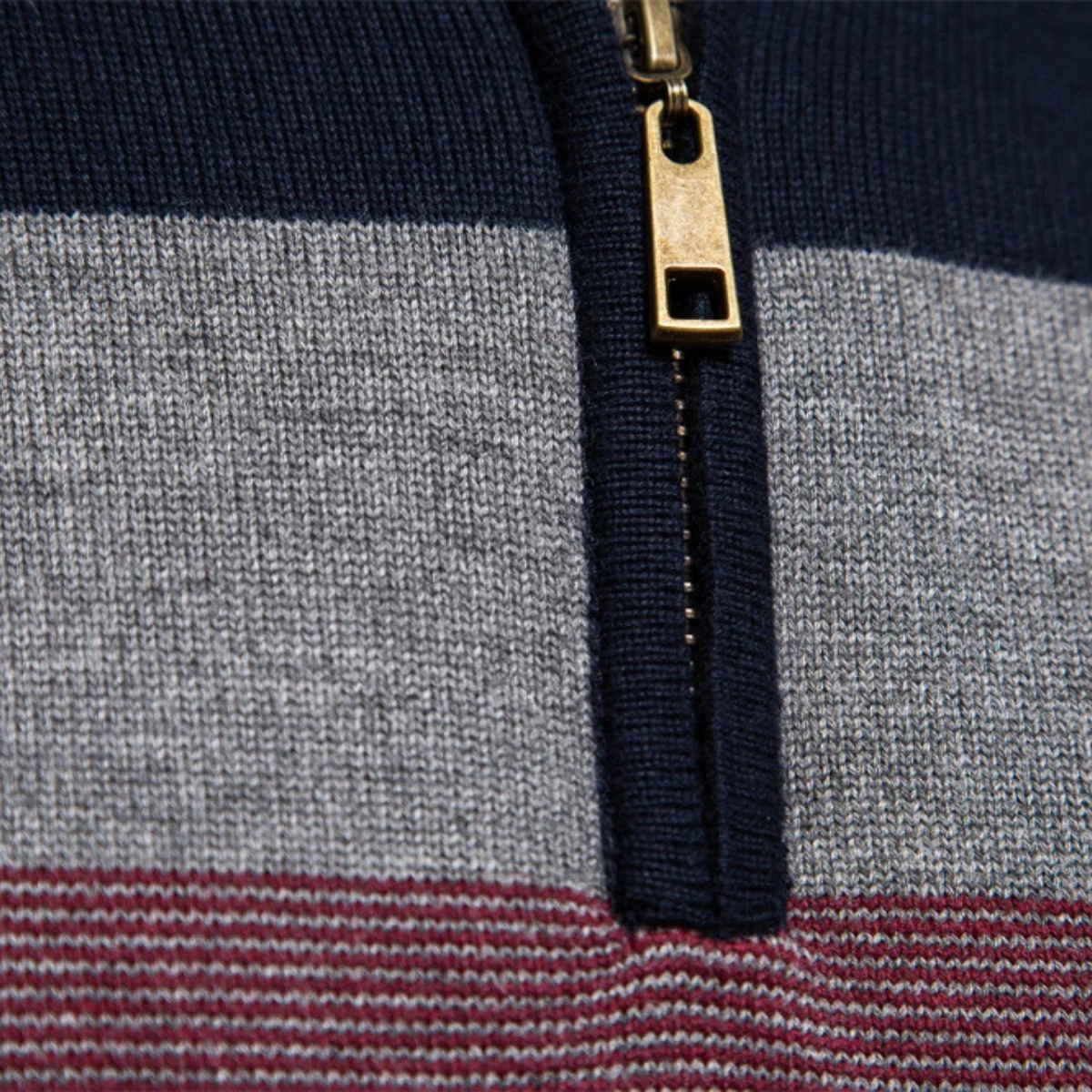Gold-zip quarter placket on navy/gray/burgundy stripe knit sweater