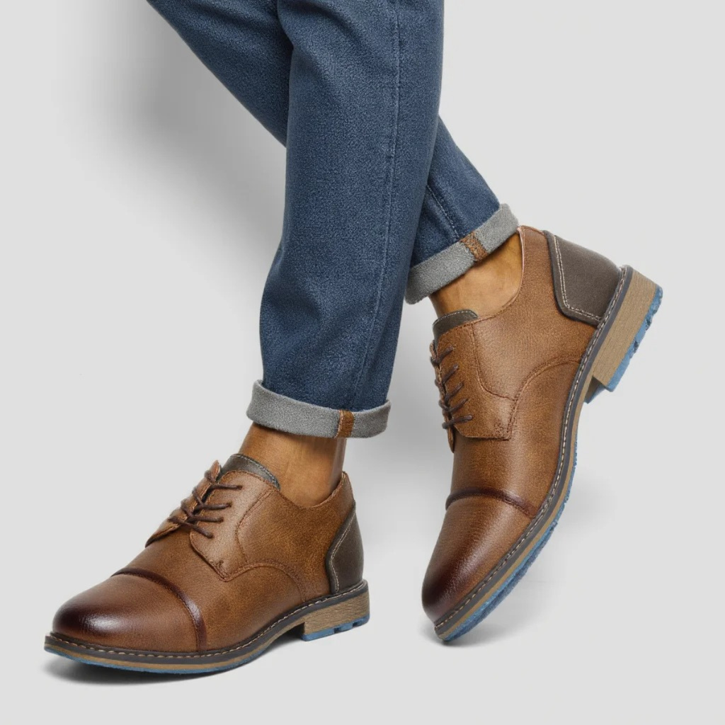 Brown leather lace-up oxford shoes with gray heel panel and blue tread sole