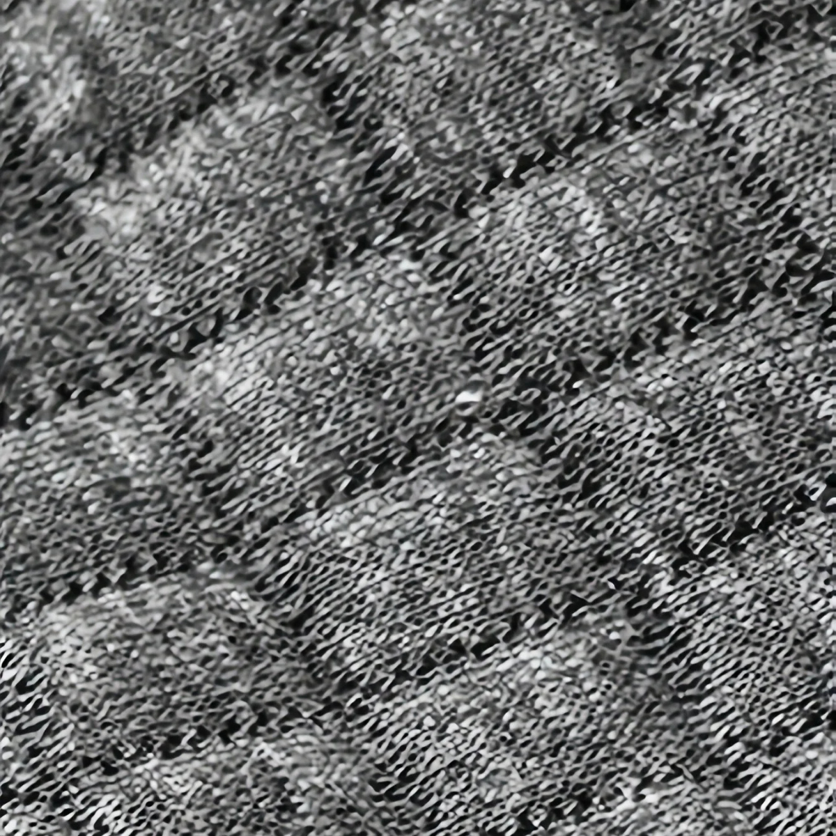 Speckled dark waffle-knit fabric texture close-up