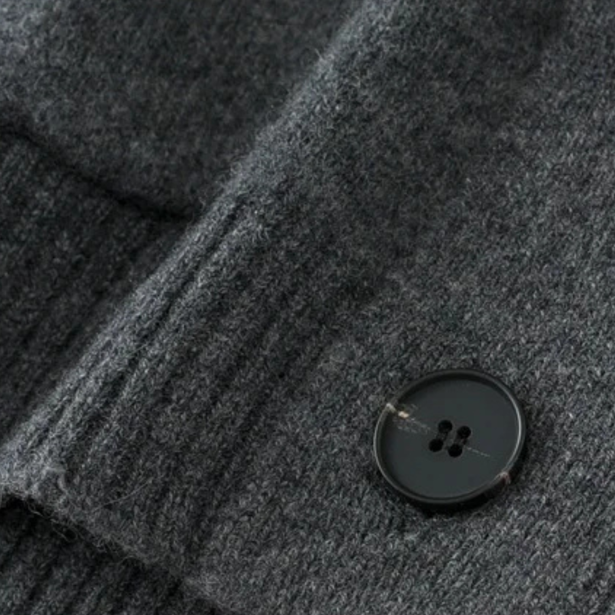 Dark gray knit cardigan with round button closure detail