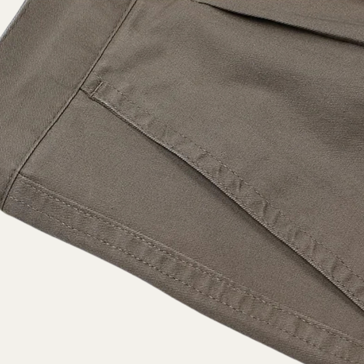 Men's double-pleated high-waist straight-leg pants in gray, stitched fabric seam close-up