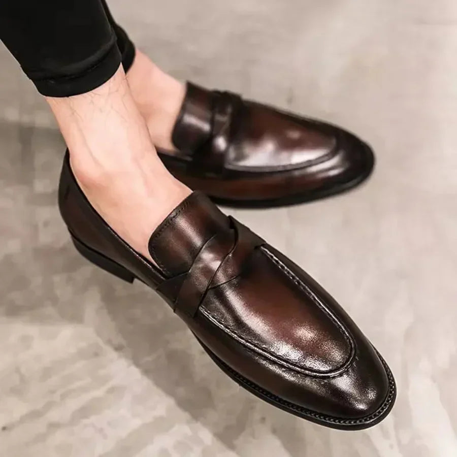 Brown leather penny loafers angled side view with low block heel