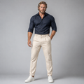 Men's white slim-fit lightweight linen dress pants on model, pleated front, cuffed hem