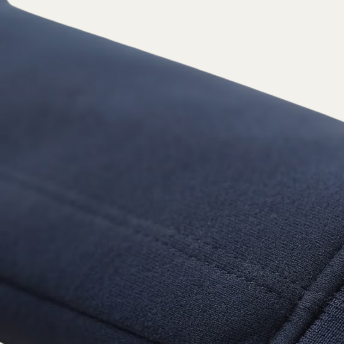 Dark navy soft shell fabric close-up with textured weave