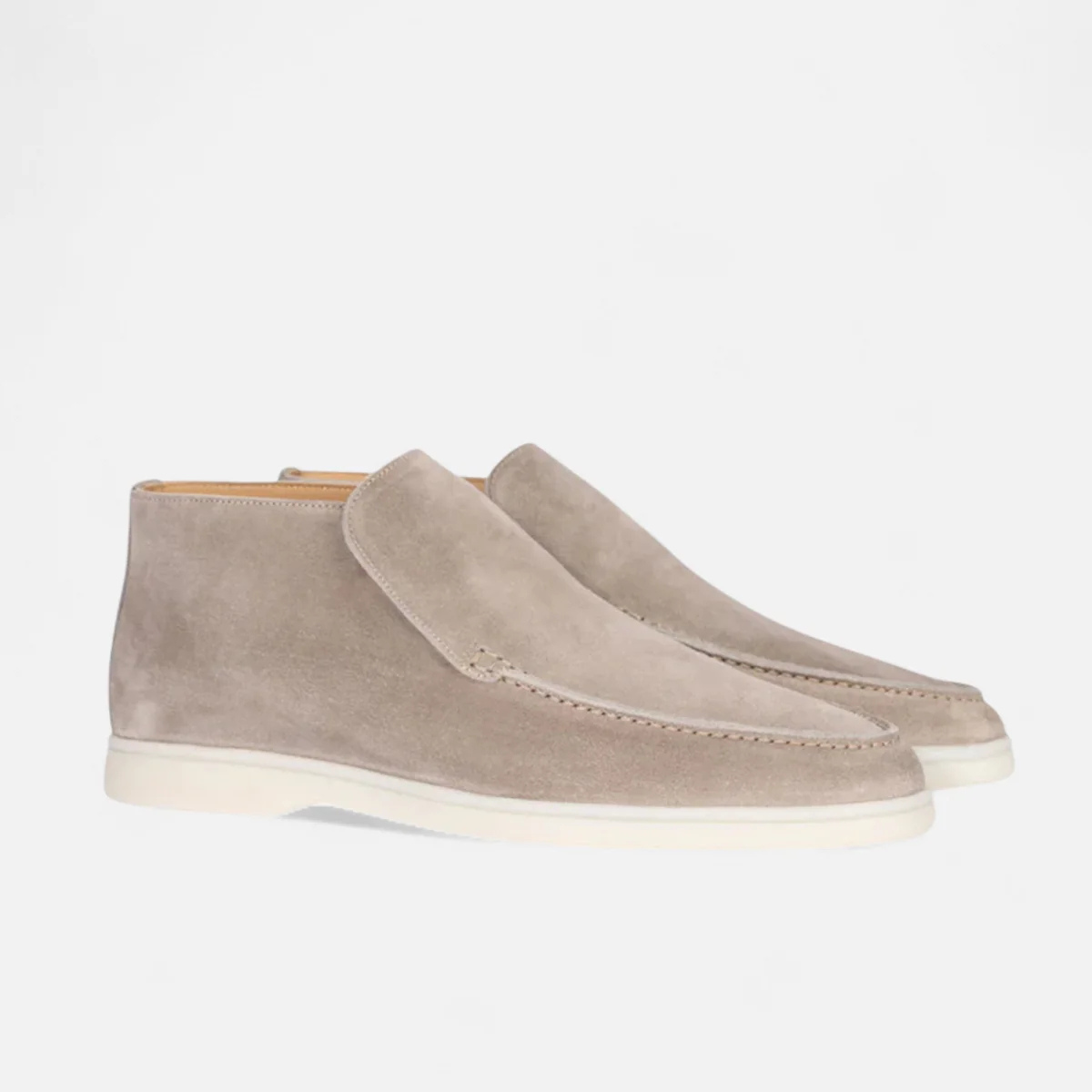 Light gray suede slip-on loafers with moc-stitched detail and white rubber sole