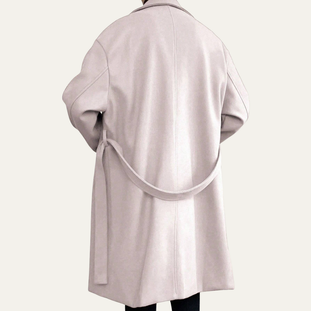 Light beige long overcoat back view with waist tie belt and vent detail