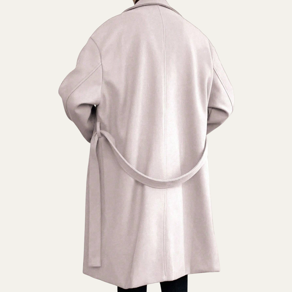 Light beige long overcoat back view with waist tie belt and vent detail