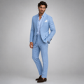 Sky blue linen slim-fit blazer and pants on model, white shirt and pocket square