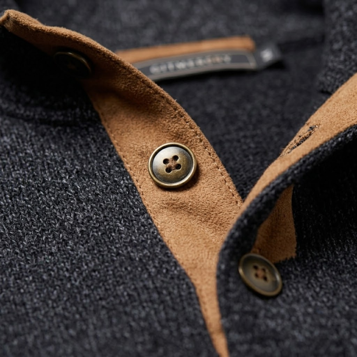 Suede stand-collar placket with two buttons on dark fleece sweater