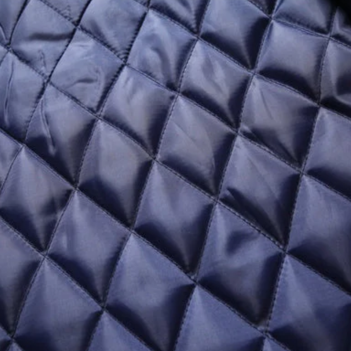 Quilted coat lining in blue with diamond stitched pattern