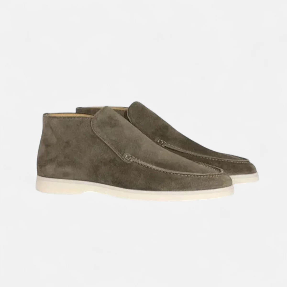Olive green suede slip-on loafers with moc-stitched detail and white rubber sole