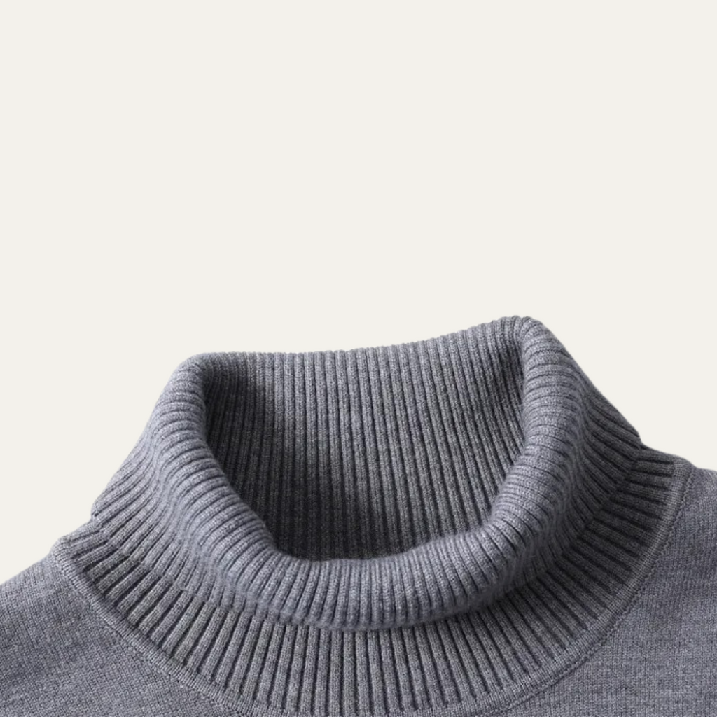 Gray turtleneck sweater close-up with ribbed collar and knit texture