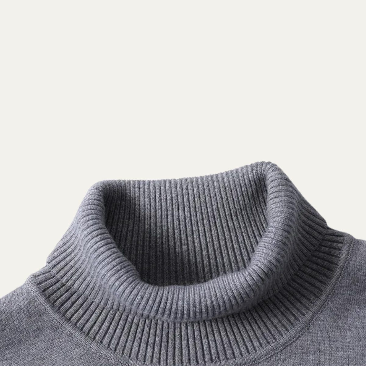 Gray turtleneck sweater close-up with ribbed collar and knit texture