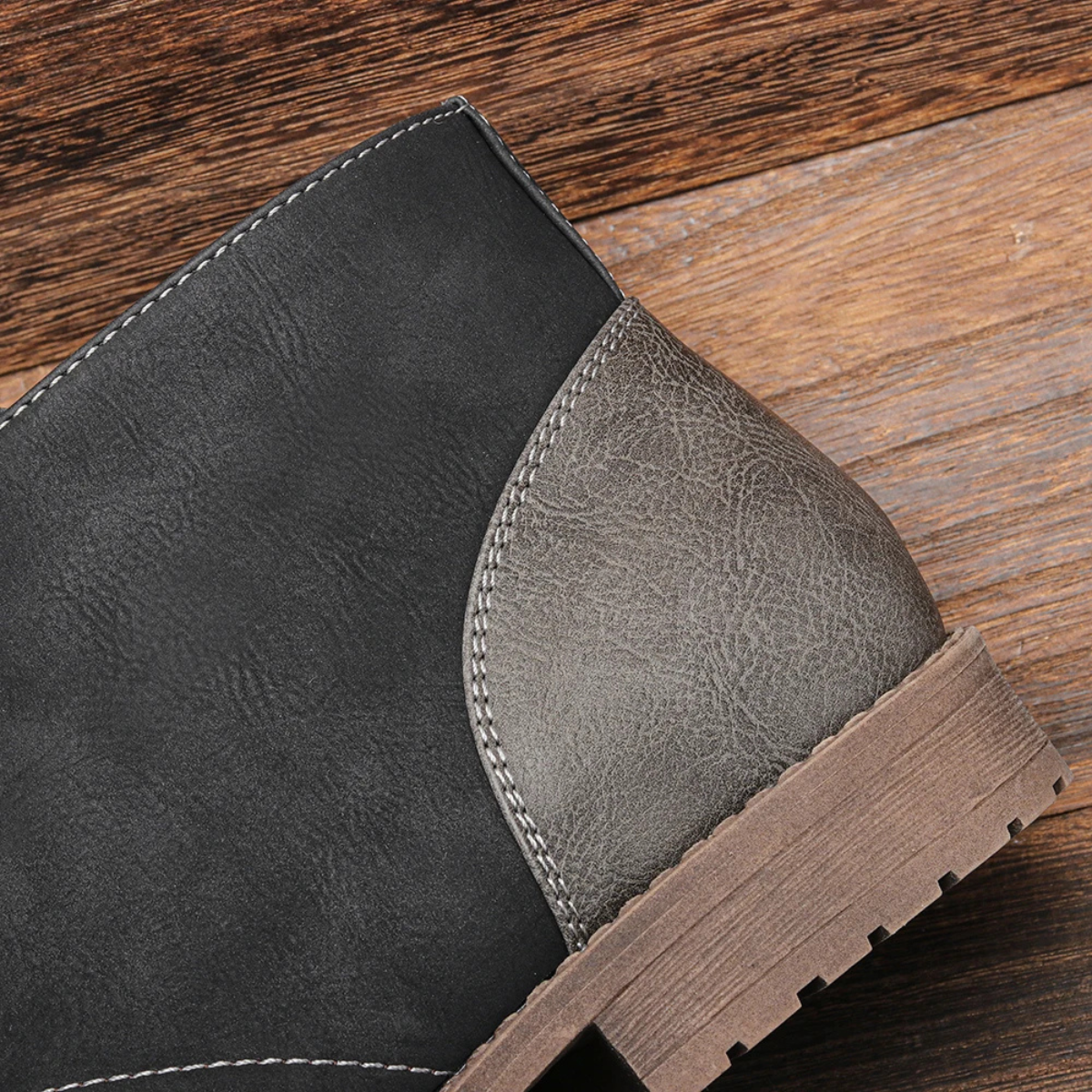 Black and gray side panel lace-up ankle boot with stitched trim and chunky outsole