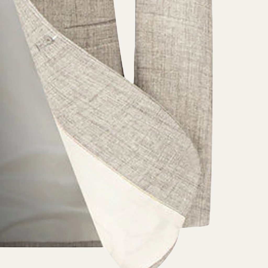 Men's beige blazer sleeve and diagonal pocket opening detail