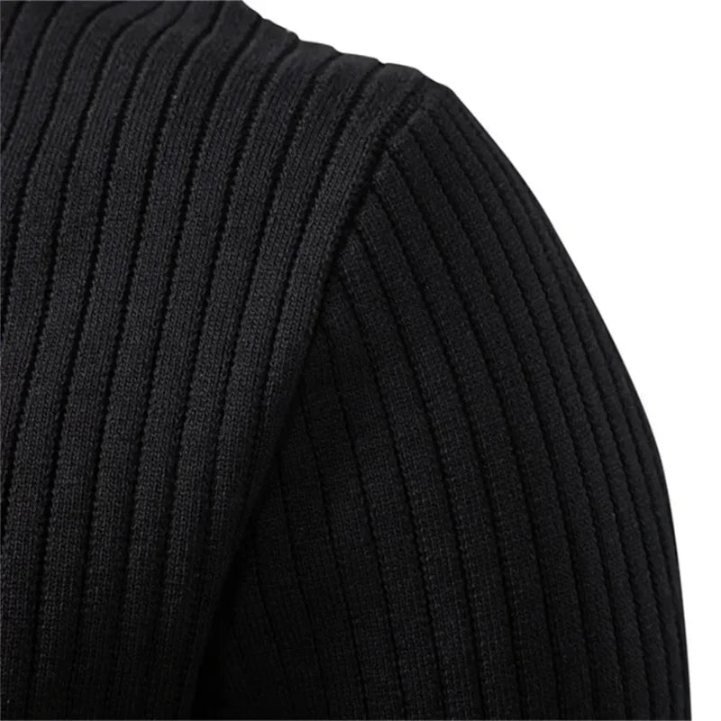 Black ribbed knit sweater sleeve detail with textured vertical stripes