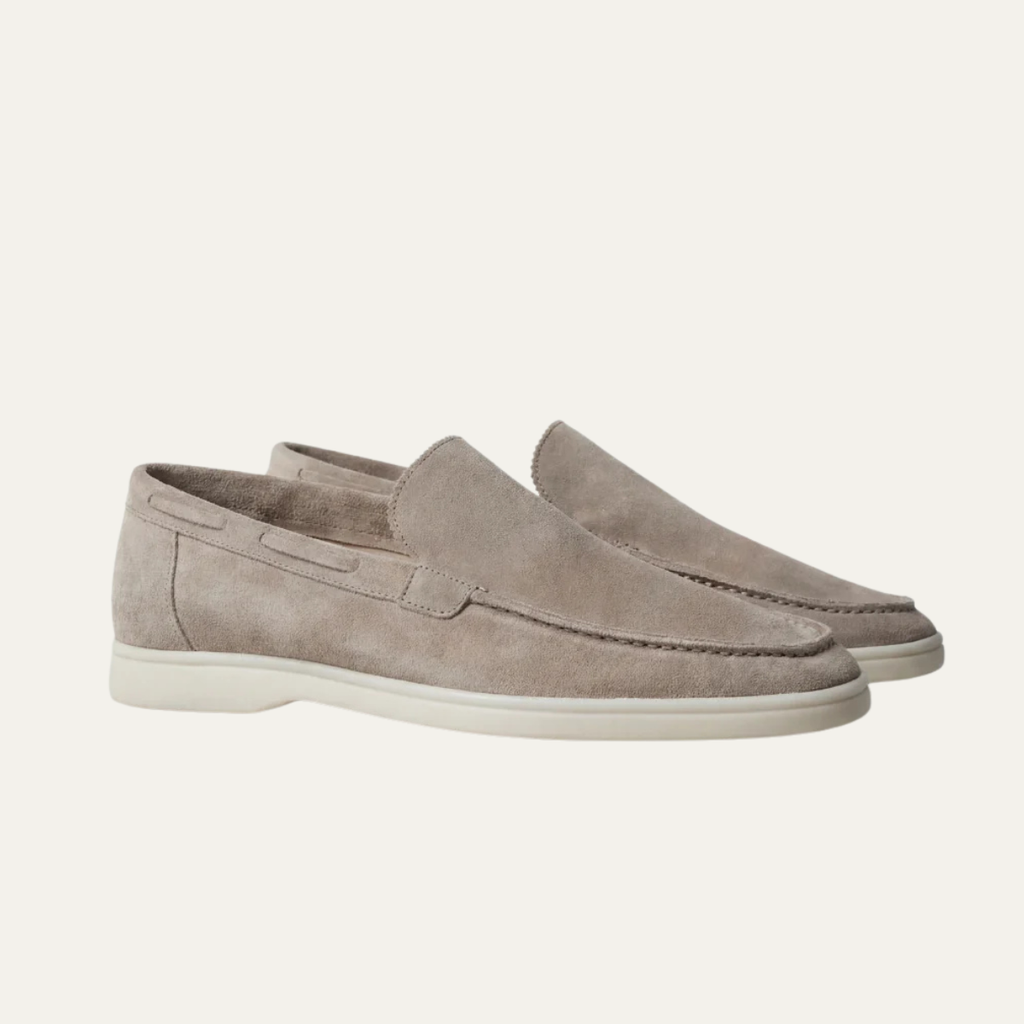 Men's beige suede slip-on loafer with moc-style stitching and low white sole