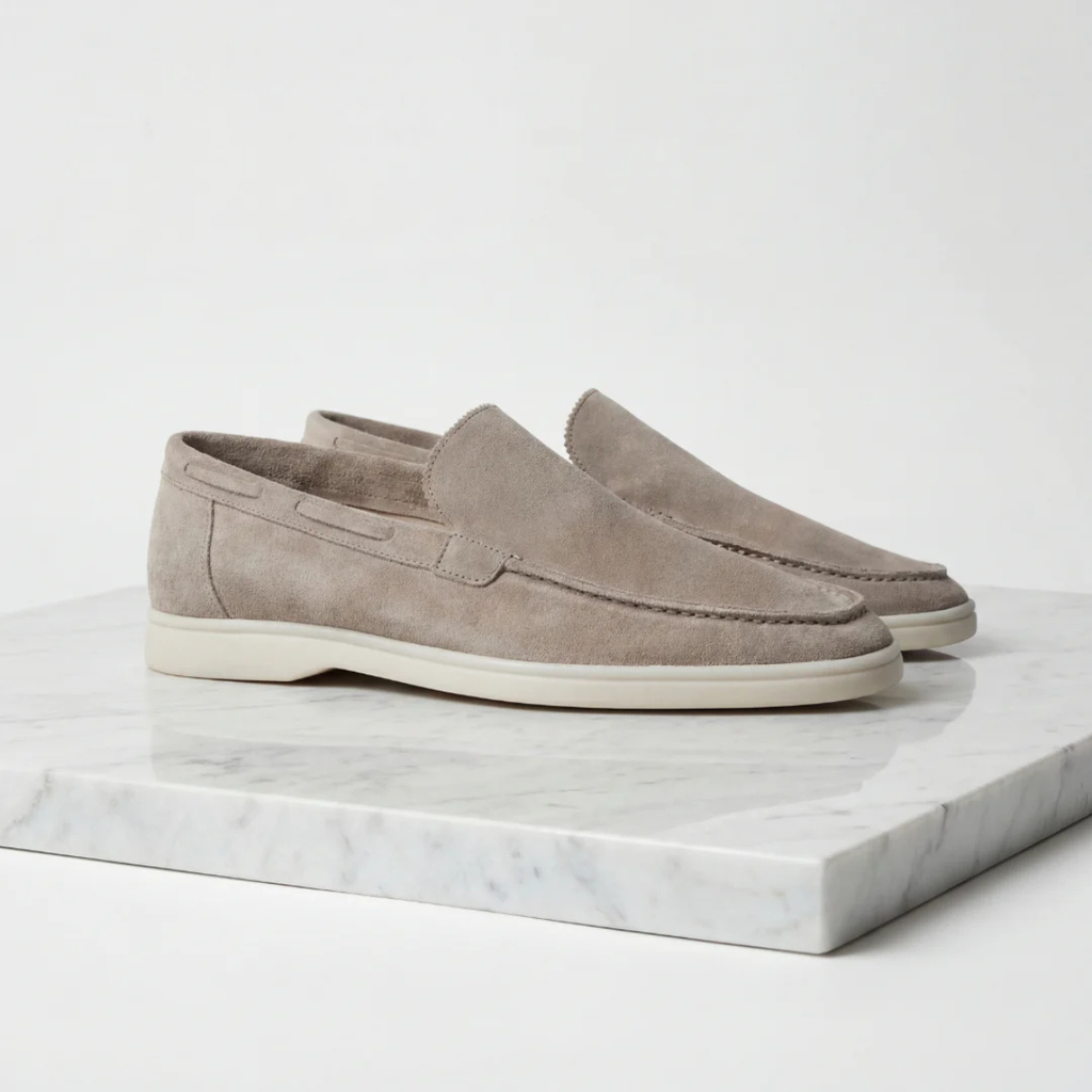 Men's beige suede moc-style slip-on loafers with stitched vamp and white rubber sole