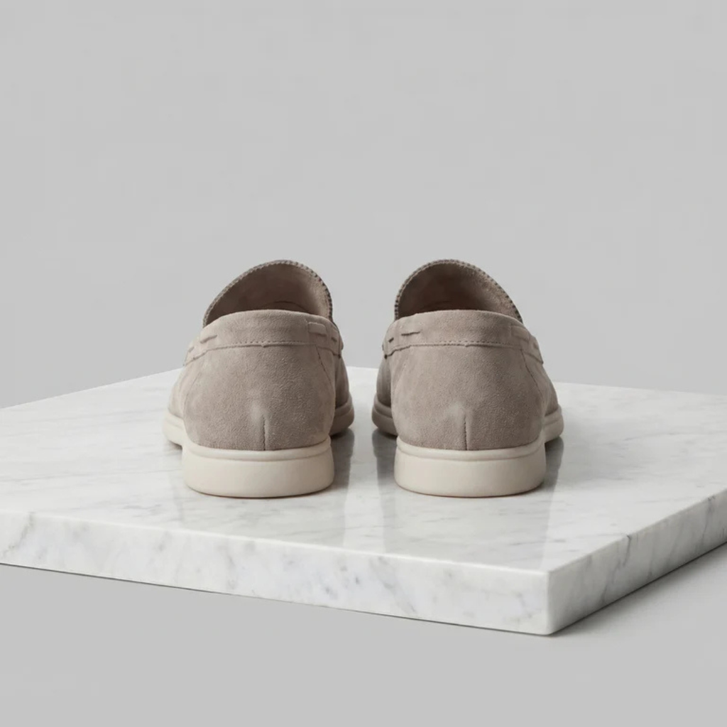 Men's beige suede slip-on loafers, rear view with heel seam and white sole
