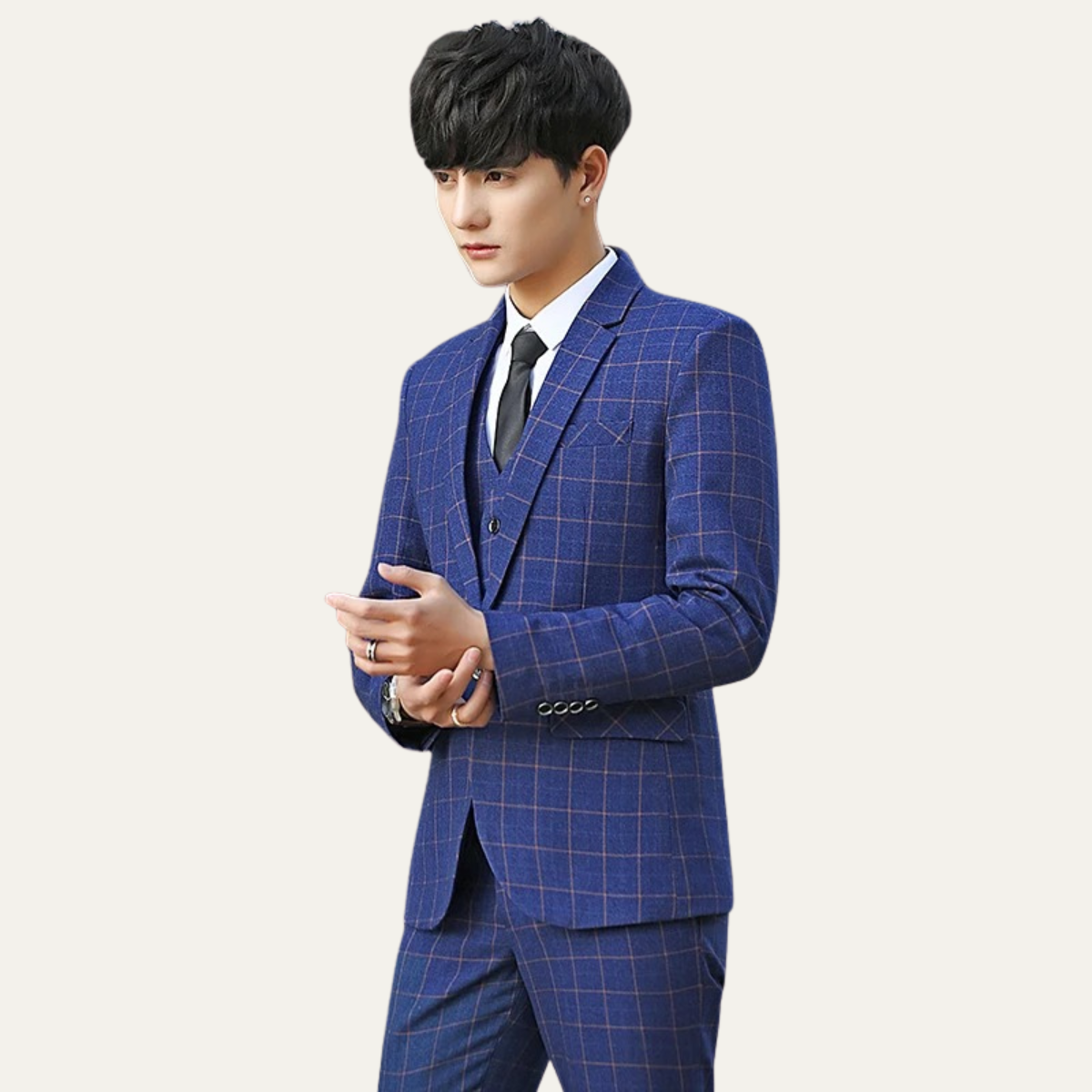Men’s plaid slim-fit suit in blue tones with blazer, vest, and dark tie