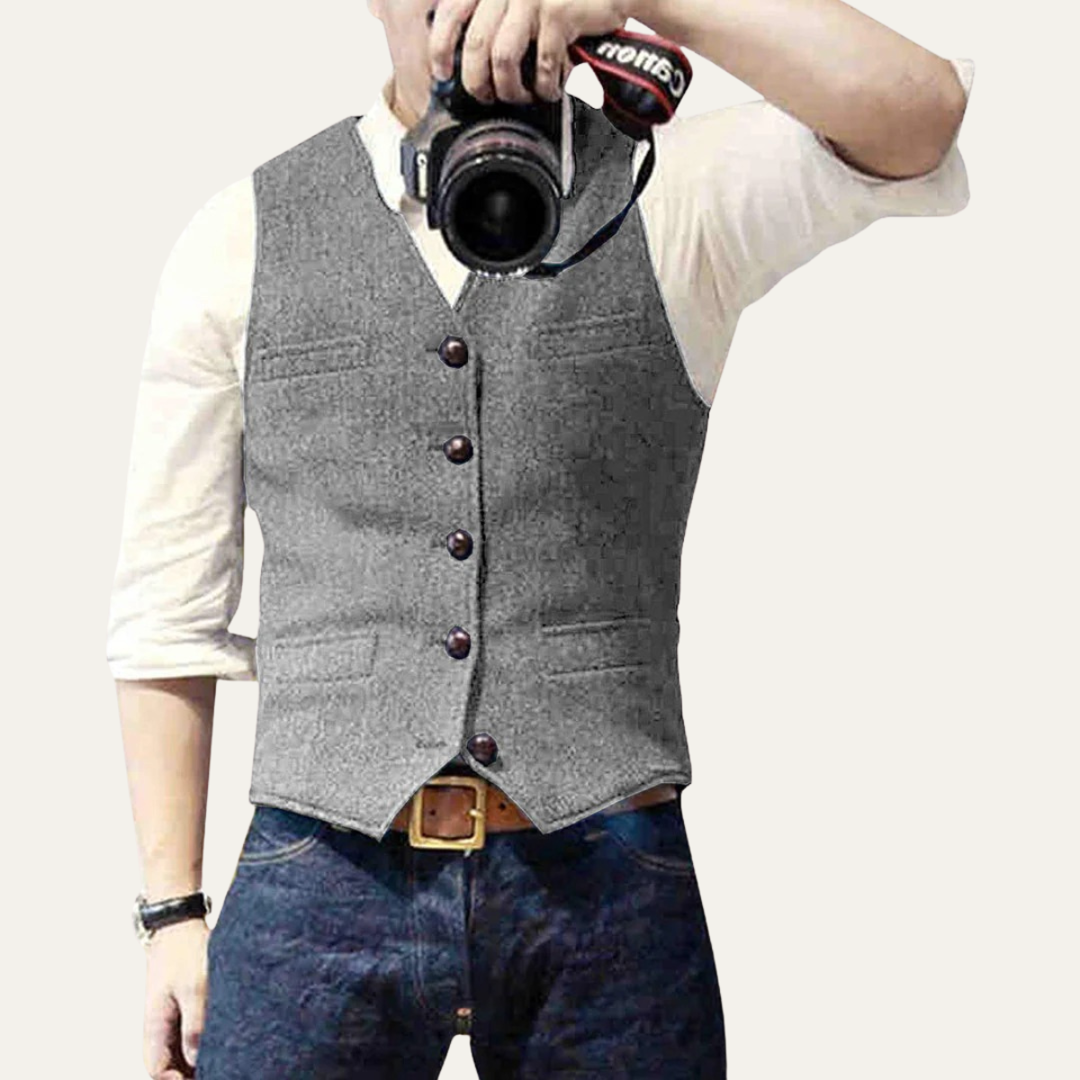 Gray sweater vest with V-neck and button front, worn over a white long-sleeve shirt.