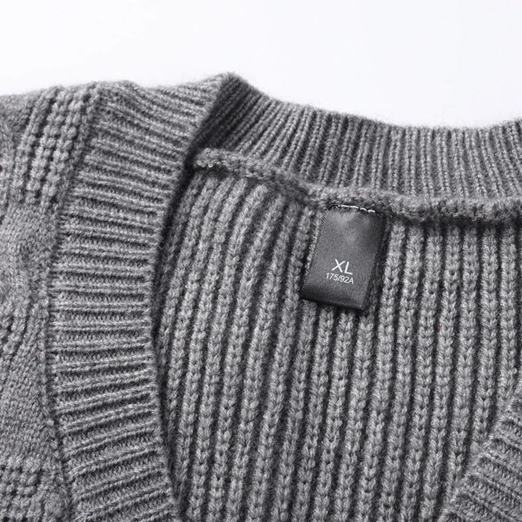 Men's gray textured knit V-neck sweater vest with ribbed trim and size XL label