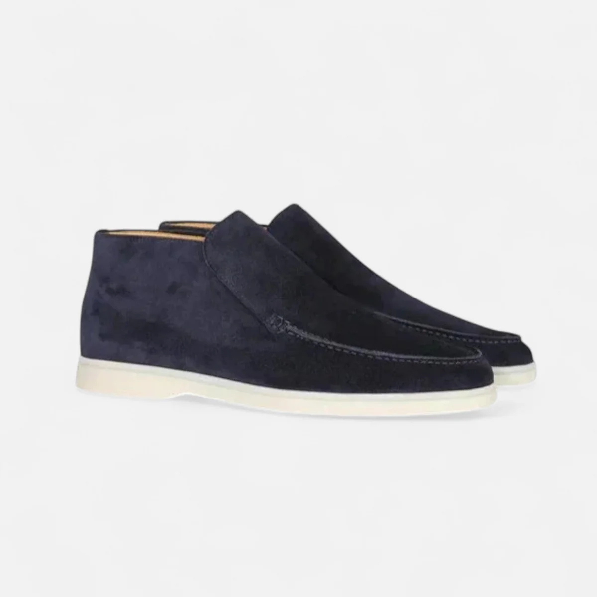 Dark navy suede slip-on loafers with moc-stitched detail and light rubber sole