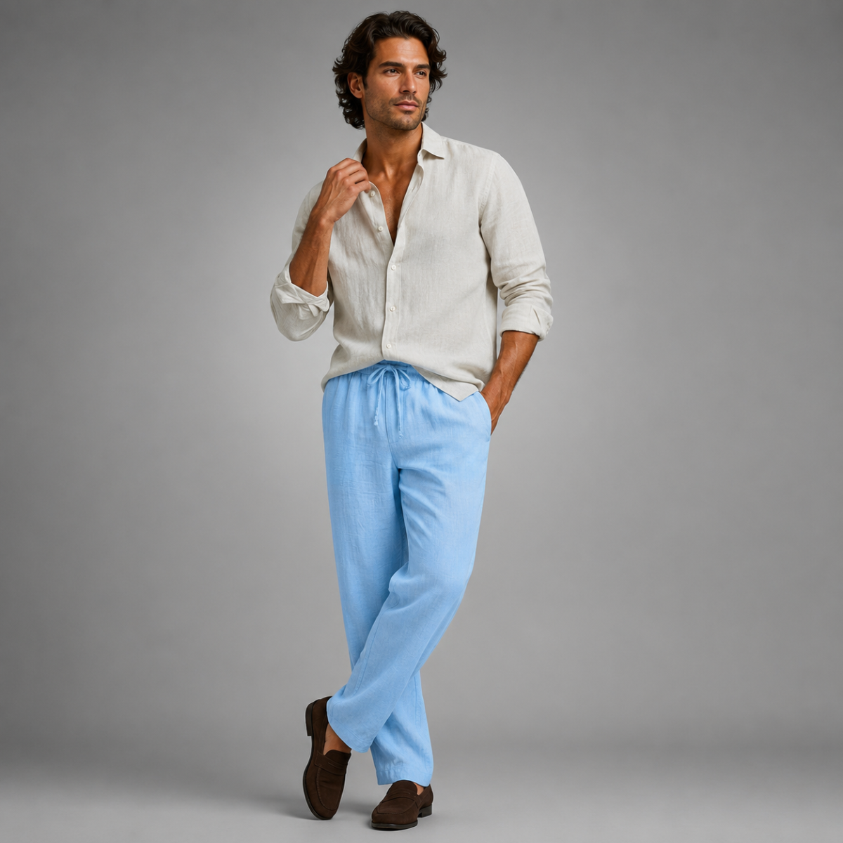 Men's light blue linen loose-fit pants with elastic waistband and drawstring