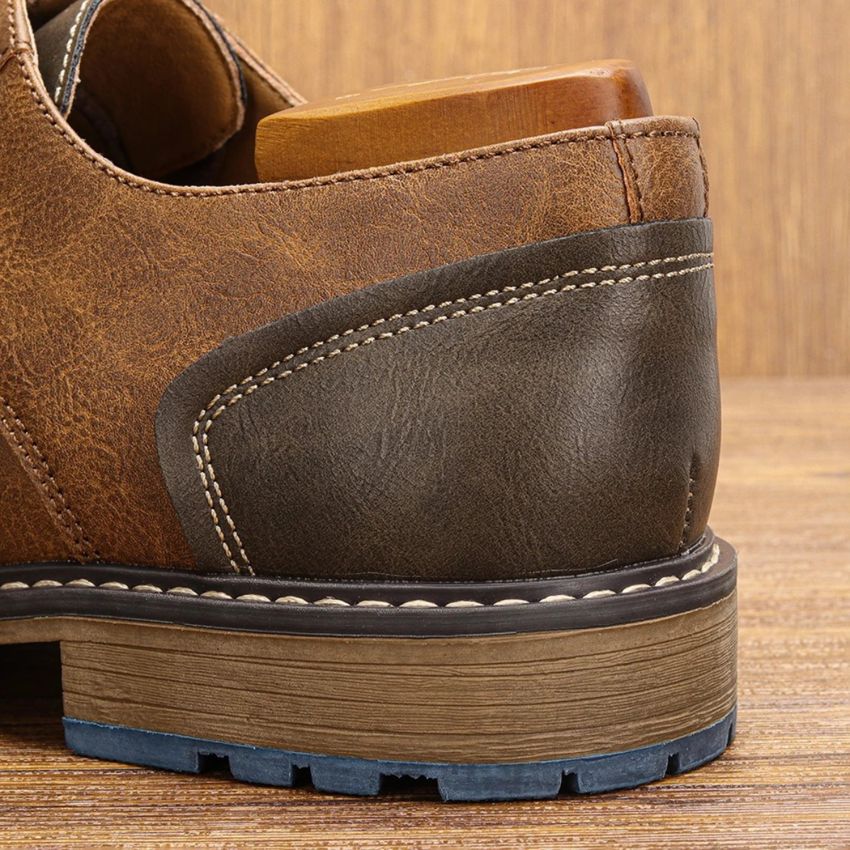 Leather oxford shoe heel with stitched panel and blue rubber outsole