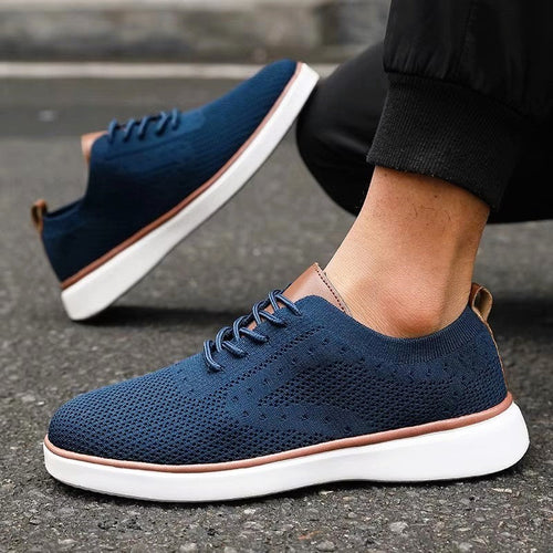 Blue lace-up mesh sneakers with white sole and brown trim