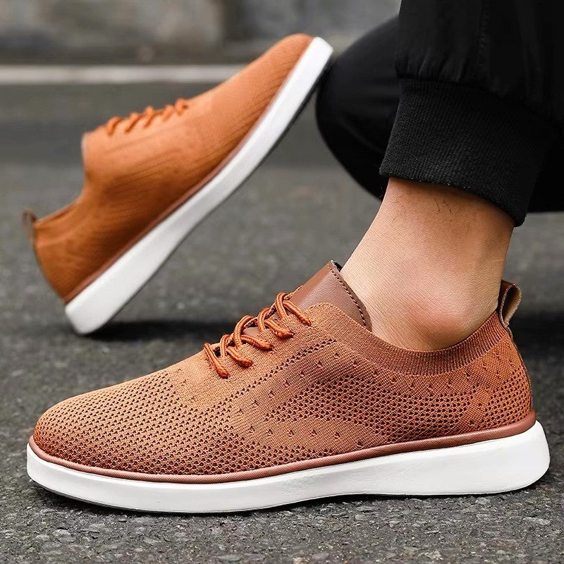 Orange lace-up mesh sneakers with white sole and brown trim