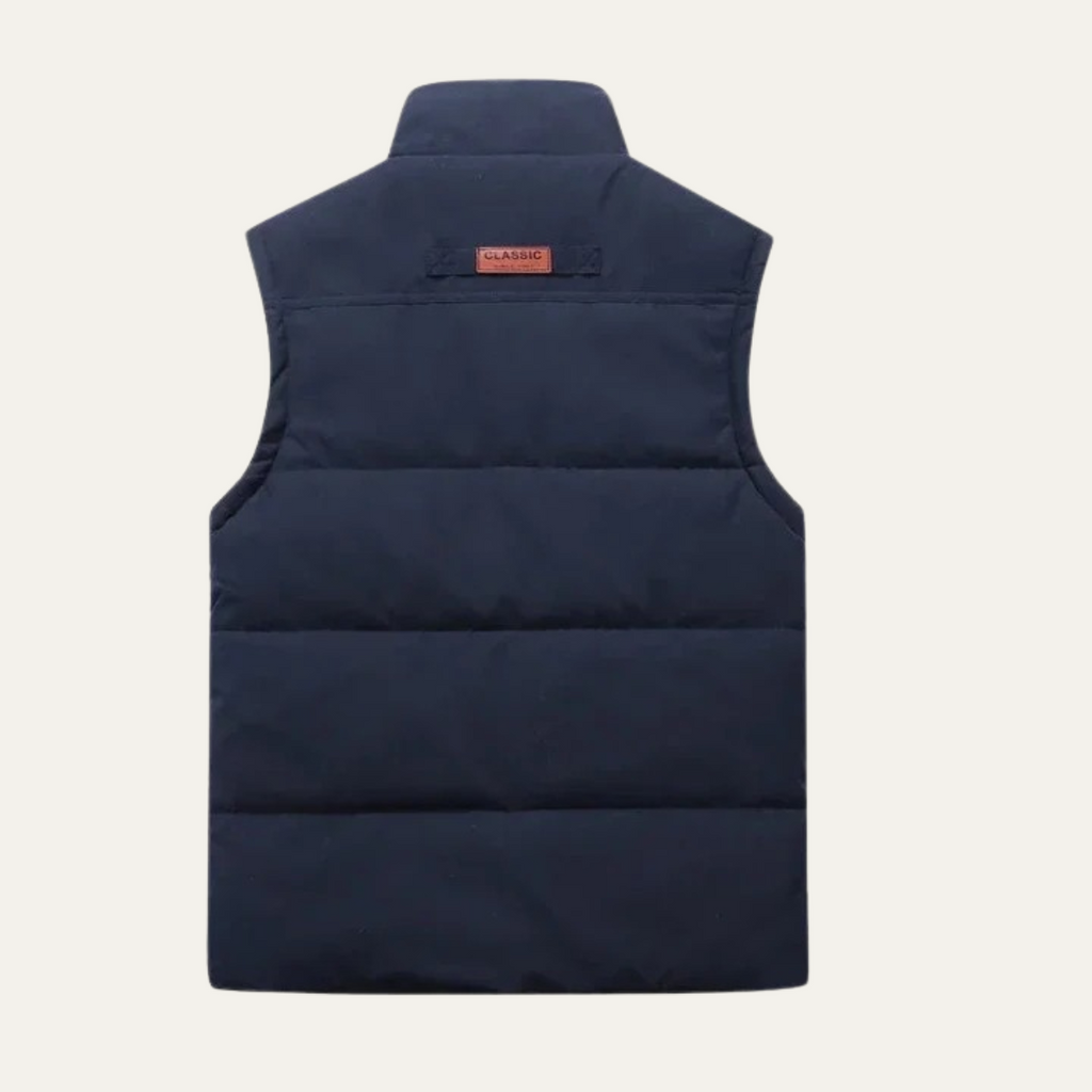 Men's navy winter vest, back view with quilted panels and stand collar