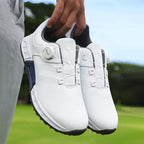 White waterproof golf shoes with lace-up front, perforated panels, and dark anti-slip sole
