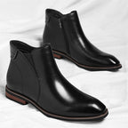Pair of Lorenzo Vitali Chelsea-style boots in black leather with elastic sides, low heel