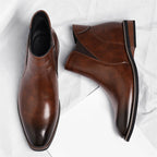 Brown Chelsea-style boots with elastic sides and stacked heel, pair view