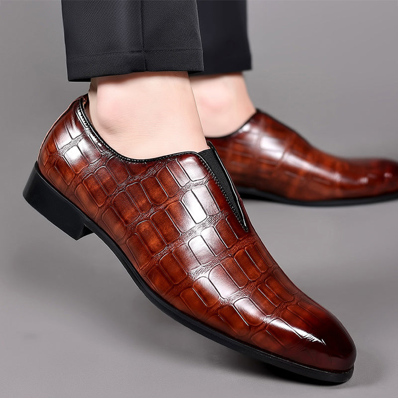 Brown croc-texture loafer with glossy finish, slip-on opening, and low block heel