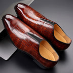 Brown glossy croc-texture slip-on loafers with polished toe and seam detail