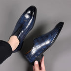 Pair of glossy blue croc-texture loafers with slip-on profile and low block heels