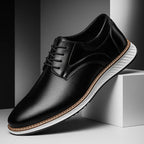 Black lace-up oxford shoes with perforated finish and white sole