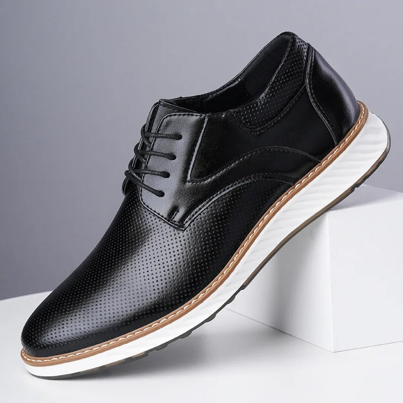 Black lace-up oxford shoes with perforated finish and white sole, side view