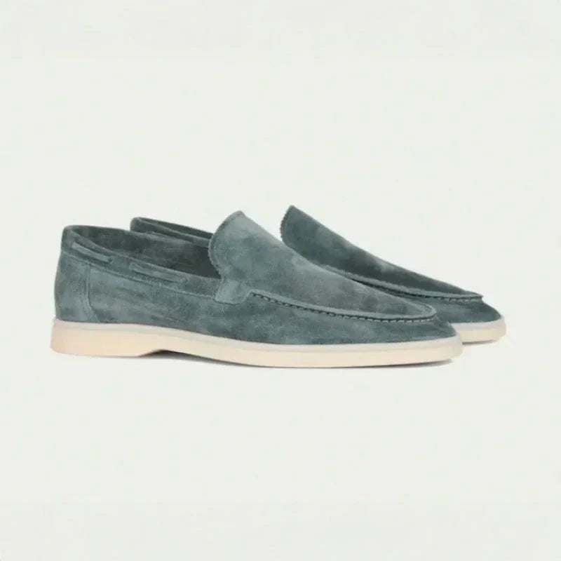 Men's gray suede slip-on loafers with moc toe stitching and light rubber sole