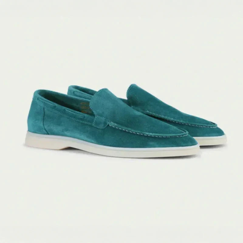 Men's teal suede slip-on loafers with moc toe seam and light rubber sole