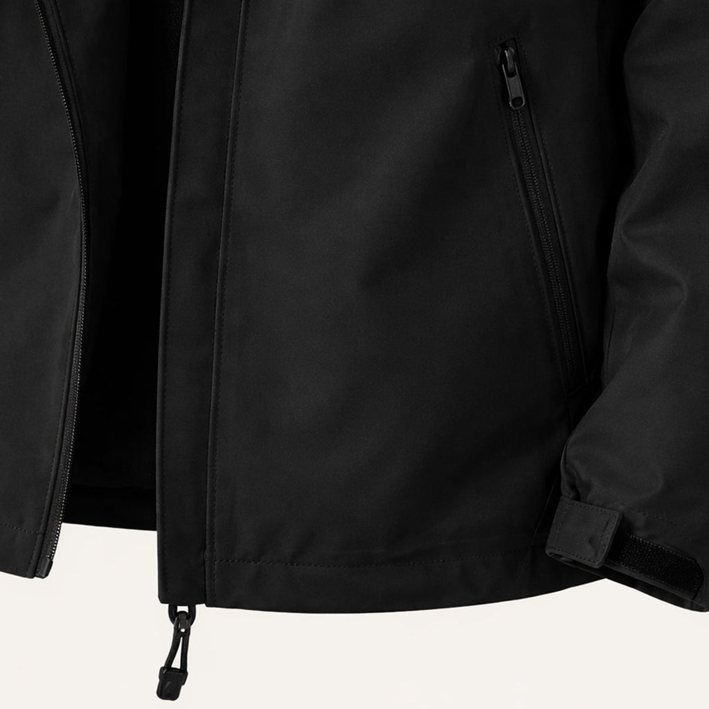 Black rain jacket detail with front zip, pockets, and adjustable cuff tabs
