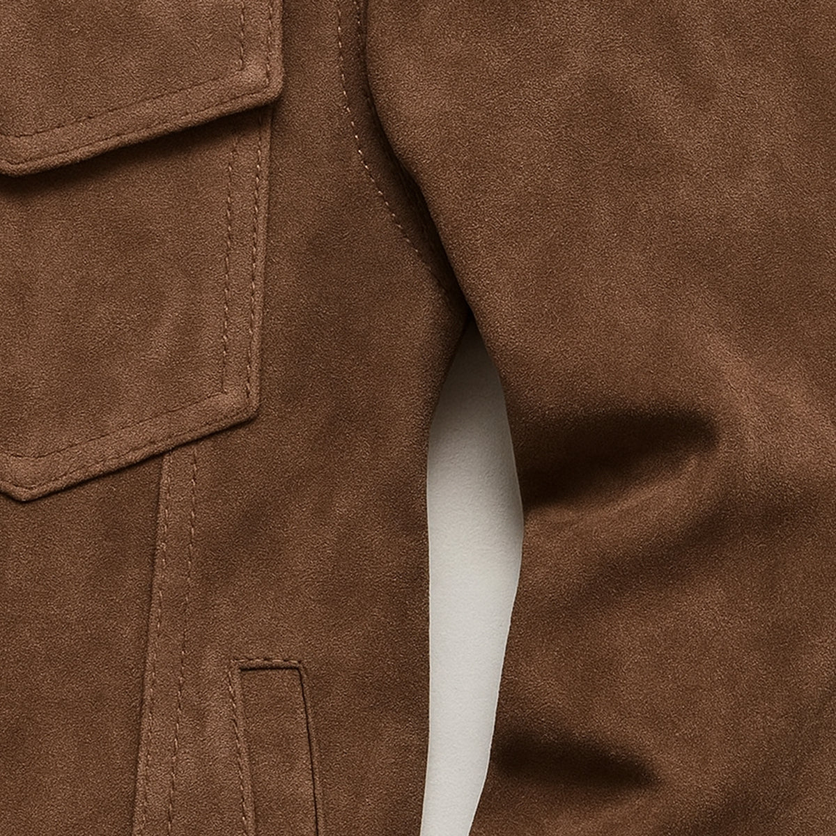 Men's suede cargo jacket, brown, close-up of flap pocket edge and stitching