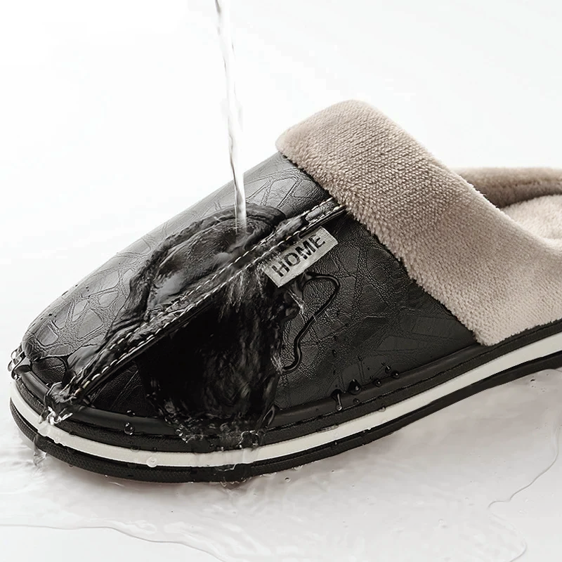 Black faux leather slip-on slippers with beige plush lining and HOME patch
