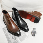 Black and brown leather ankle dress boots, lace-up with pointed toe and low heel.