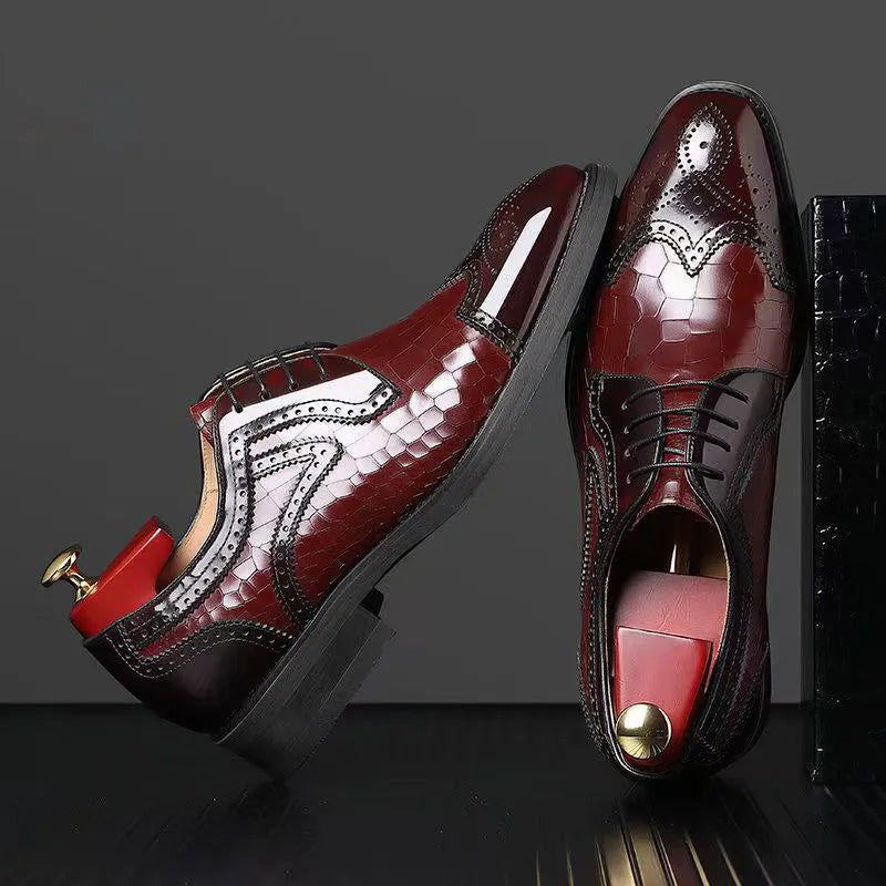 Red leather-look lace-up oxford shoes with brogue detailing, patterned vamp, and dark laces