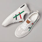 Pair of beige genuine leather retro sneakers with white laces and multicolor stripe